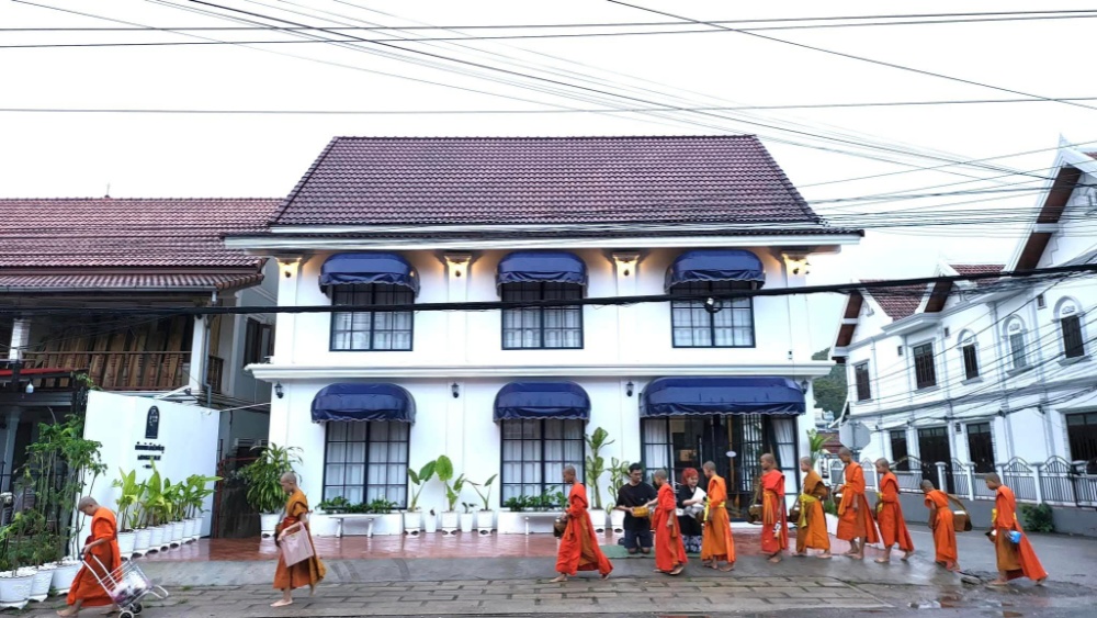 Morning view with monks passing by